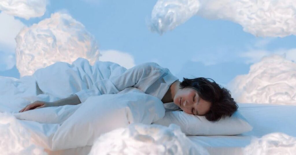 A women sleeping near fluffy clouds. REM sleep and a vital stages of sleep cycles